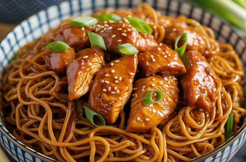 sticky garlic chicken noodles in a bowl