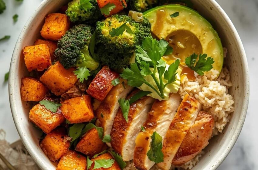 A hearty meal prep bowl with sliced maple-Dijon roasted chicken