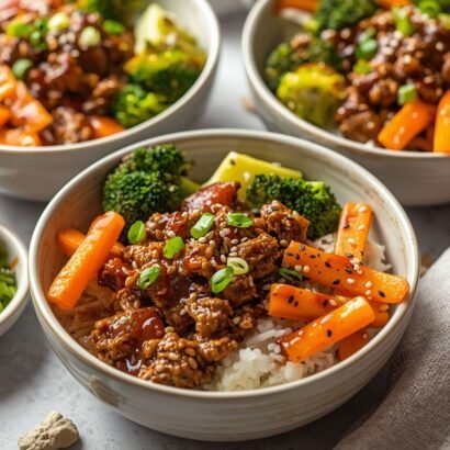 A set of warm food bowls with savory seasoned ground beef