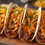 Four warm flour tortillas filled with seasoned ground beef