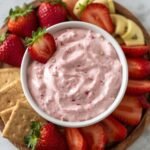pink strawberry dessert dip with visible small strawberry pieces