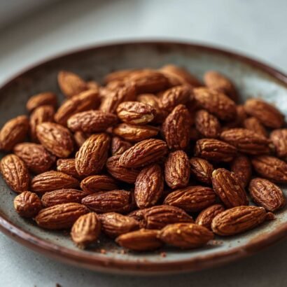 warm spiced roasted almonds on a rustic plate